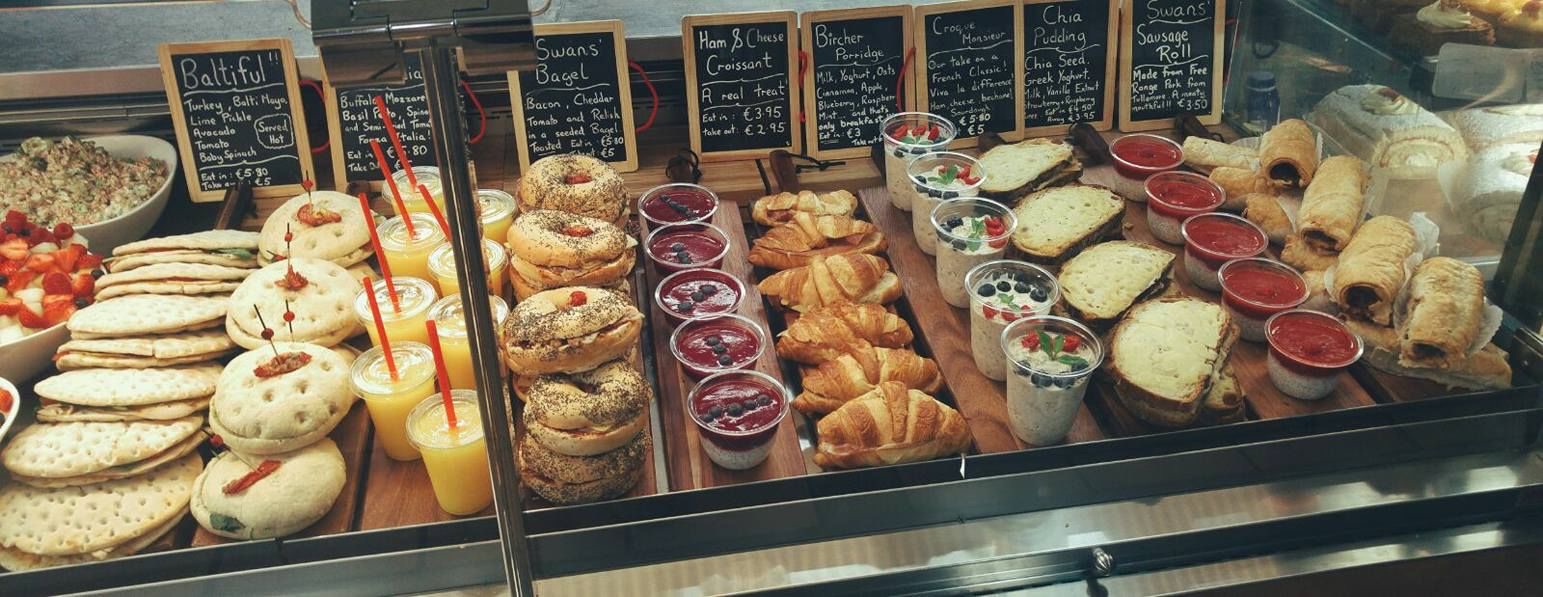 The deli counter lined with croissants, bagels, flatbreads, filled rolls and fresh juices
